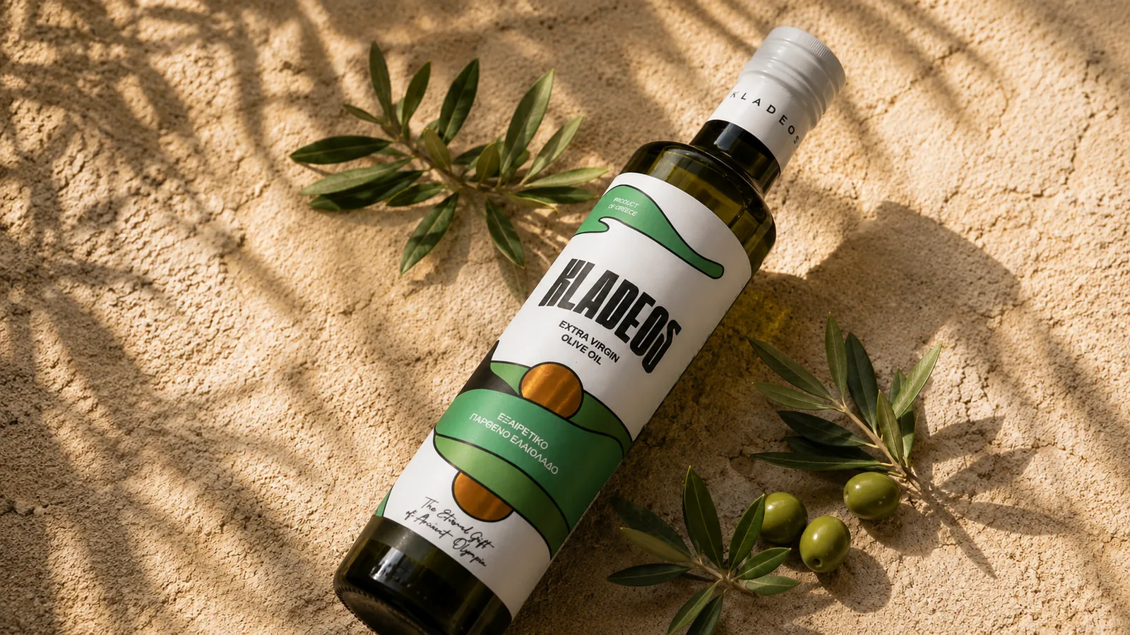 Kladeos extra virgin olive oil bottle with olives and an olive branch